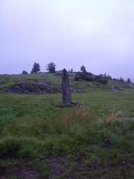 Runstenen vid Hoga på Orust, sedd från platsen för äldre fägata, den 2 september 2005. — Unknown creator (source declares public domain). Public Domain Mark 1.0